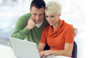 Couple looking at Georgia health insurance quotes online.